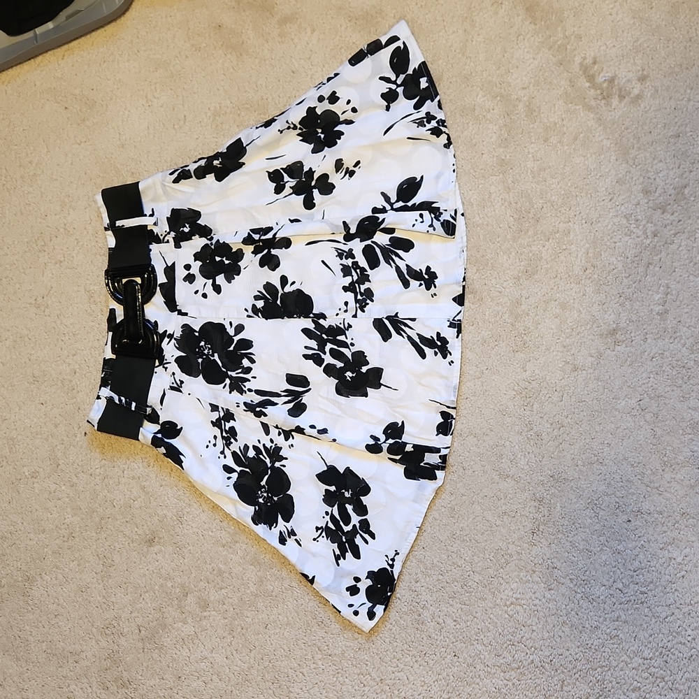 Size 3 Speak 2 Me back and white skirt with belt.